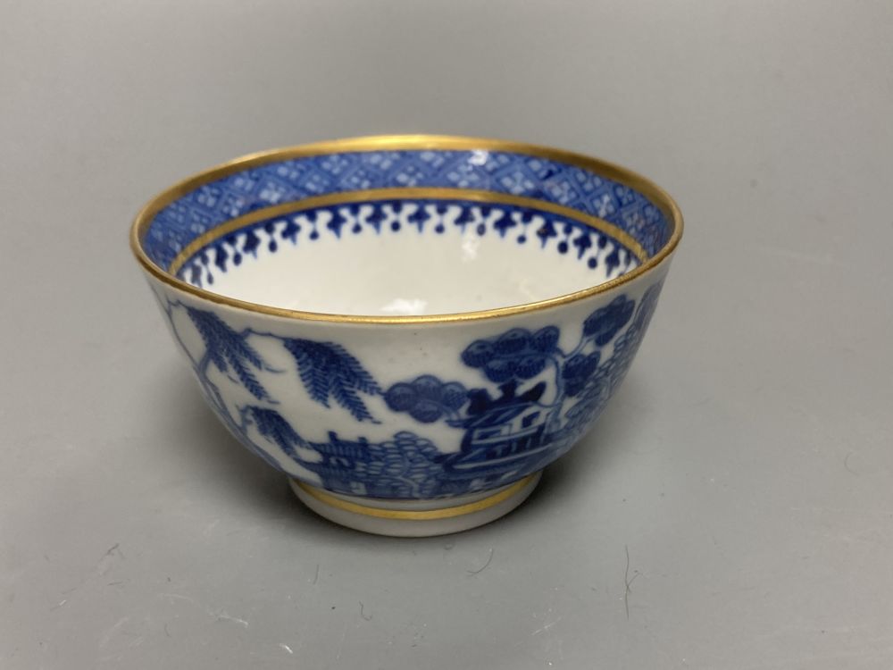An 18th century English blue and white tea bowl and three smaller Chinese ceramic cups, two marks